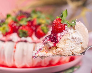 a piece of cake on a fork with a bite taken out of it